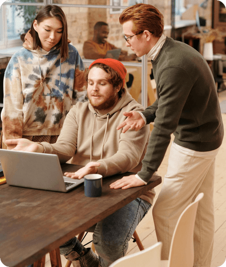 A small team reviewing their taxes on a laptop